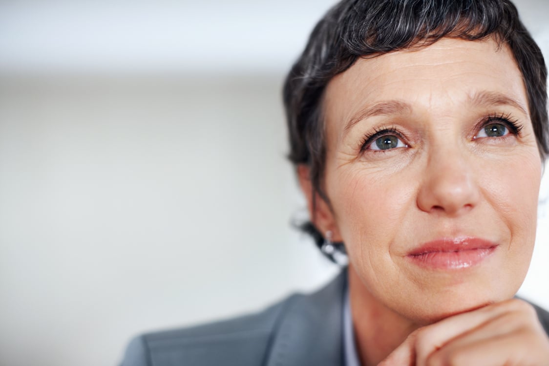 Pensive Female Executive. Closeup of Contemplative Female Execut